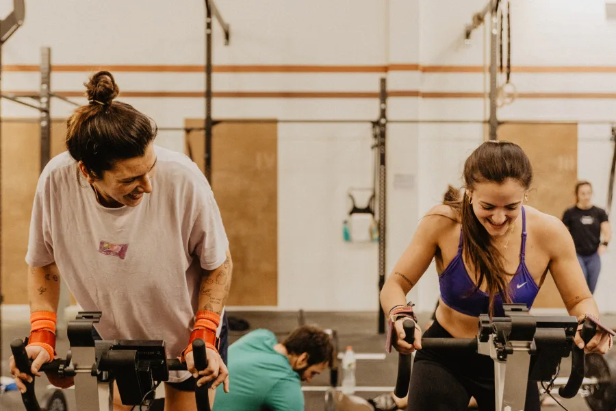 Three athletes celebrating after an intense workout