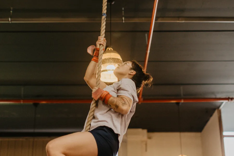 Athlete performing ring muscle-ups during WOD